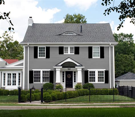 white house with grey metal.roof and.wood shutters|exterior shutter colors white house.